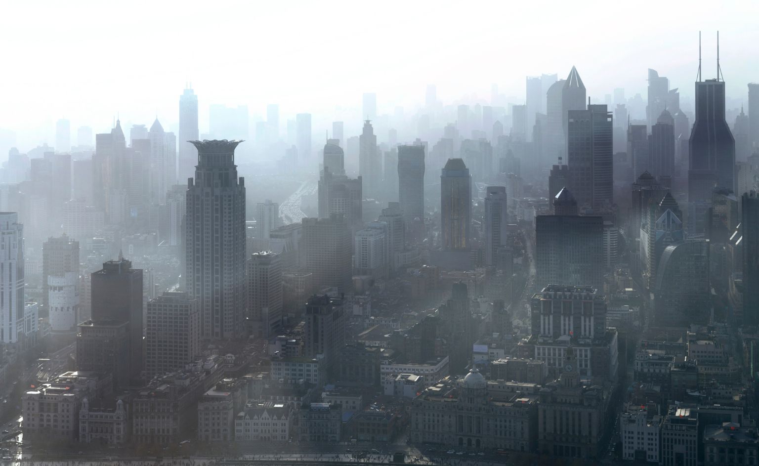 Particle Measurement VOC Sensing Technology-2 | ION SENSE Dense city skyline with tall skyscrapers fading into foggy haze.